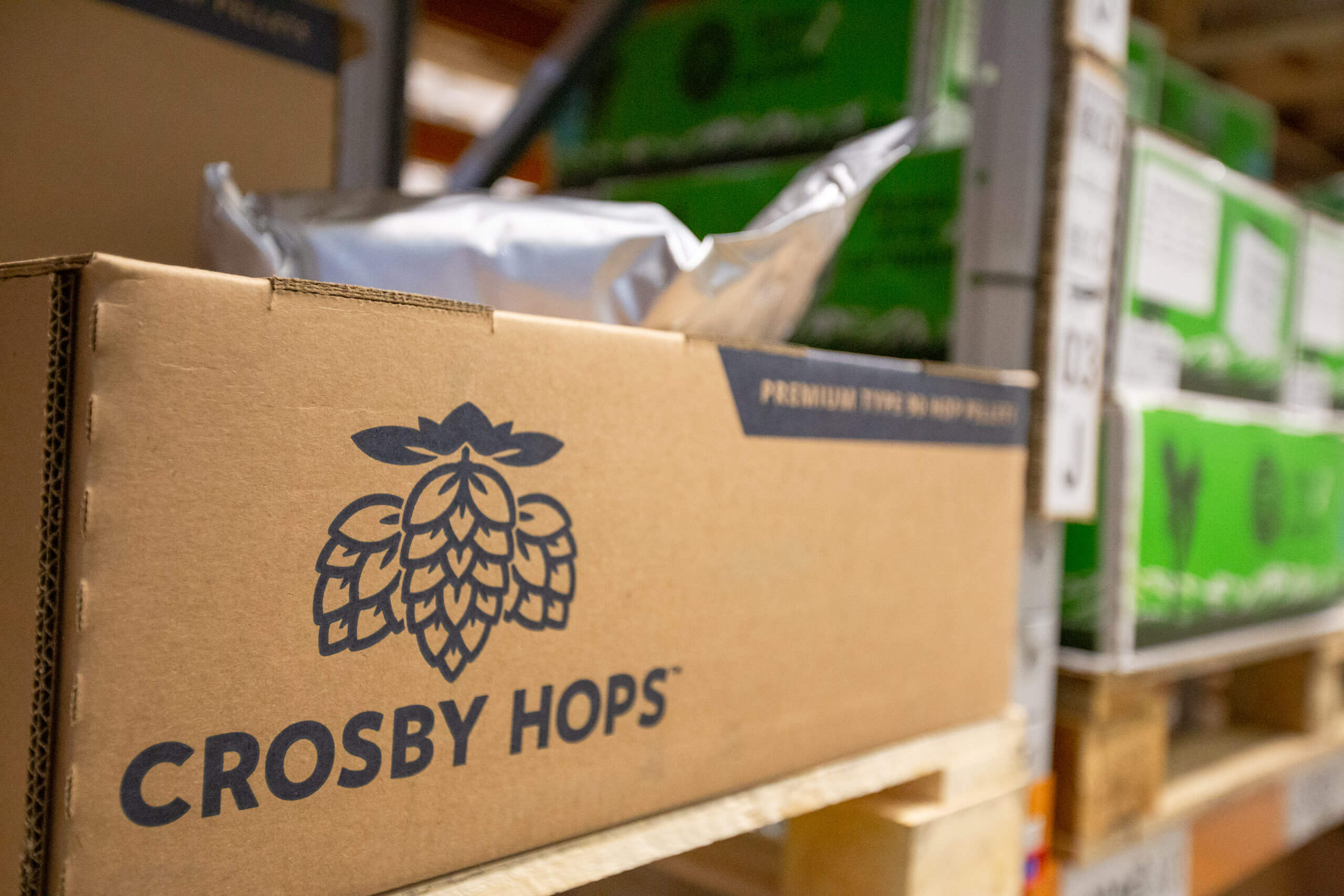 A box of Crosby Hops T90 hop pellets in the Loughran Brewers Select cold store warehouse in Peterborough.