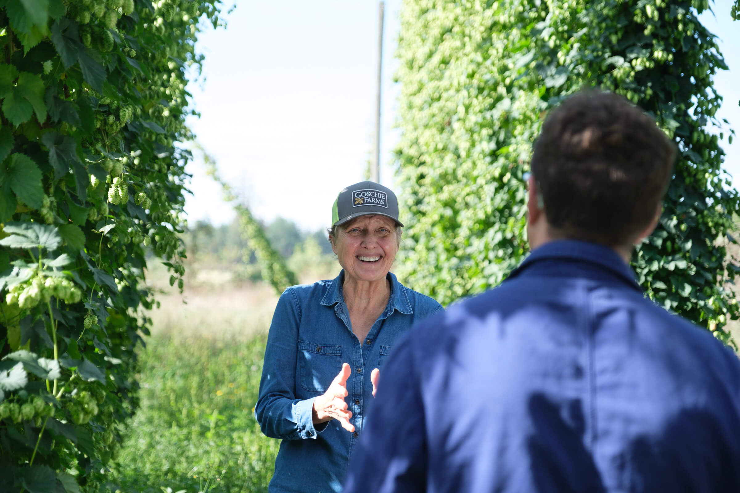 Goschie Farms' Gayle Goschie chats to DEYA's Theo Freyne in a hop field about sustainable hop farming
