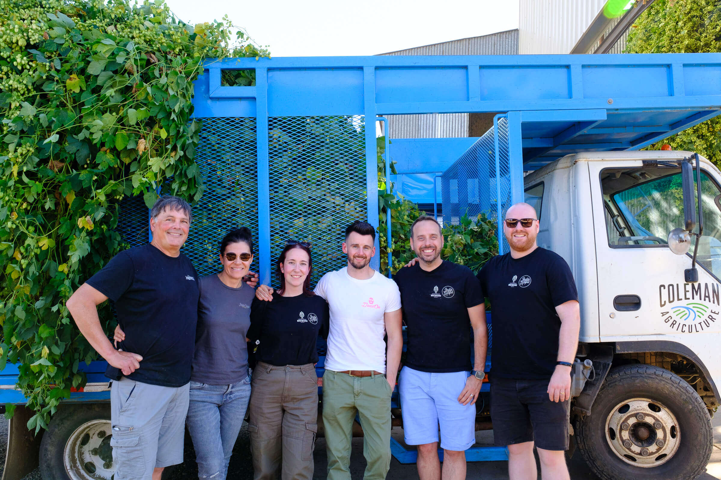 Jim Solberg (Indie Hops), Anca Solberg (Indie Hops), Natasha Lawlor (Loughran Brewers Select), Andrew Hamilton (Wicklow Wolf), James Loughran (Loughran Brewers Select), Dan Rybinski (Loughran Brewers Select) in front of hop truck at Coleman Agriculture