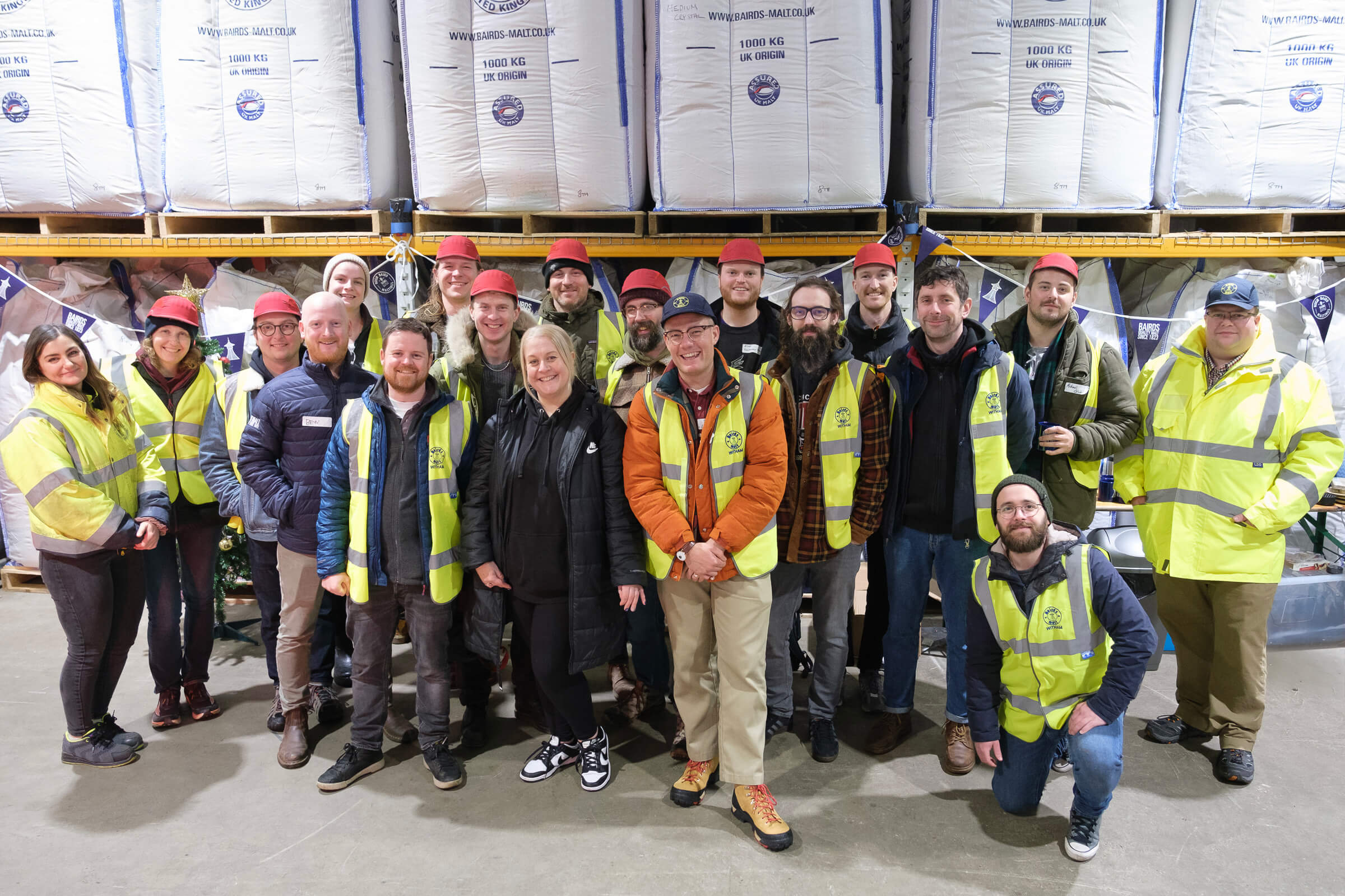 Staff at Bairds Malt Witham maltings pose for a photo with Lallemand Brewing, Loughran Brewers Select, & brewing customers from East London Brewing, Brewhouse & Kitchen, Curious Brew, Orbit after attending a malting course.