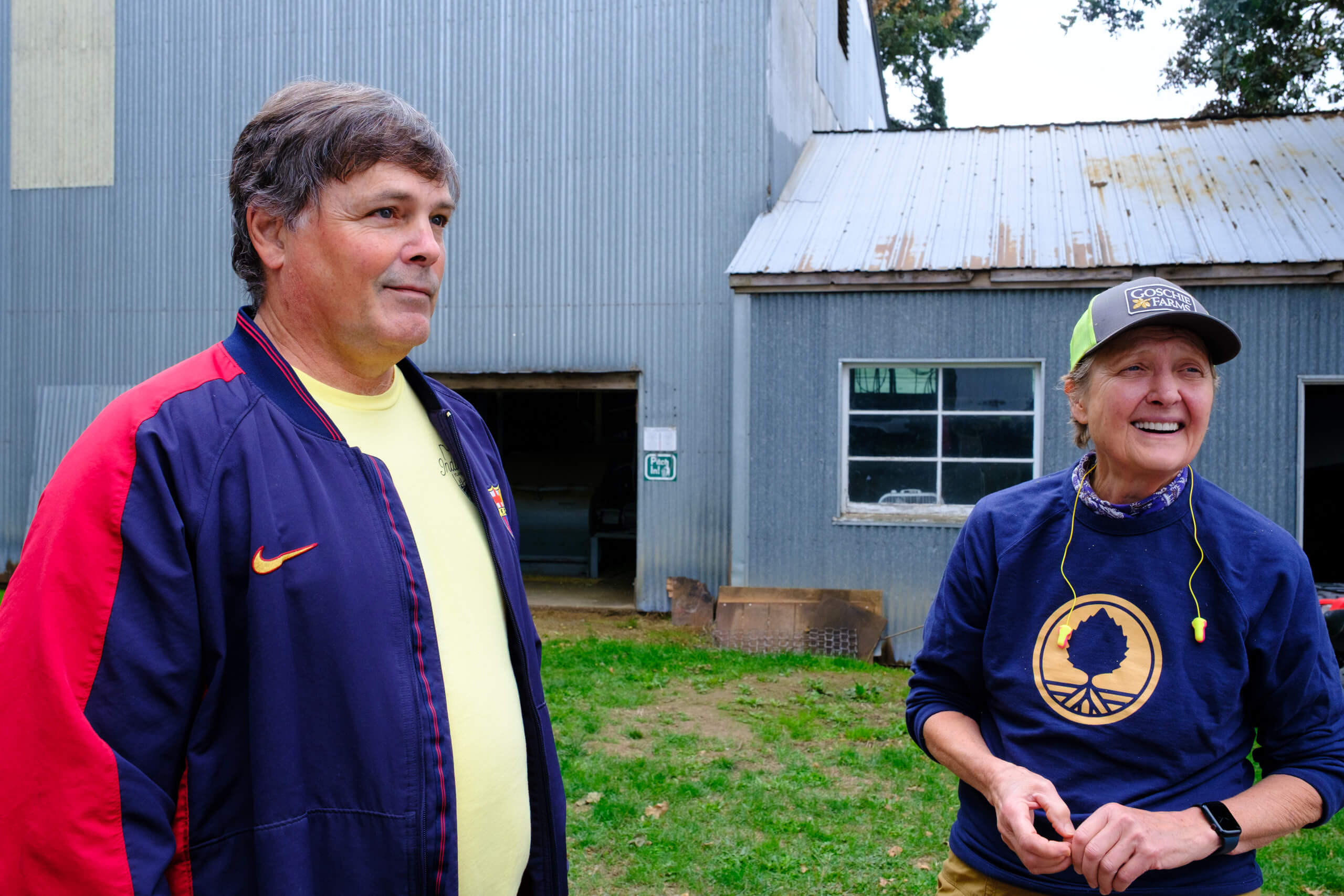 Jim Solberg (Indie Hops) chats to Gail Goschie in the yard at Gosche Farms in Oregon, USA.